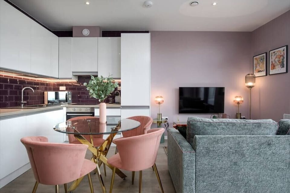 Integrated living, bedroom, and kitchen spaces in an open layout.
