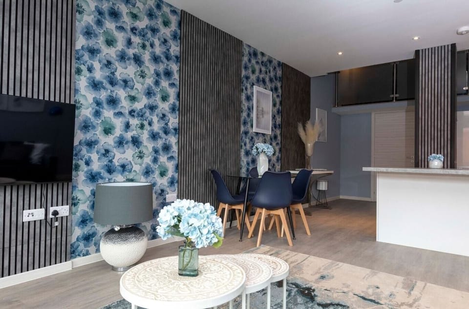 Integrated living, bedroom, and kitchen spaces in an open layout.