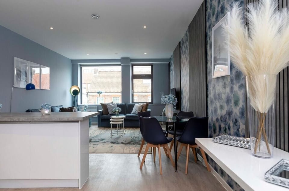 Integrated living, bedroom, and kitchen spaces in an open layout.