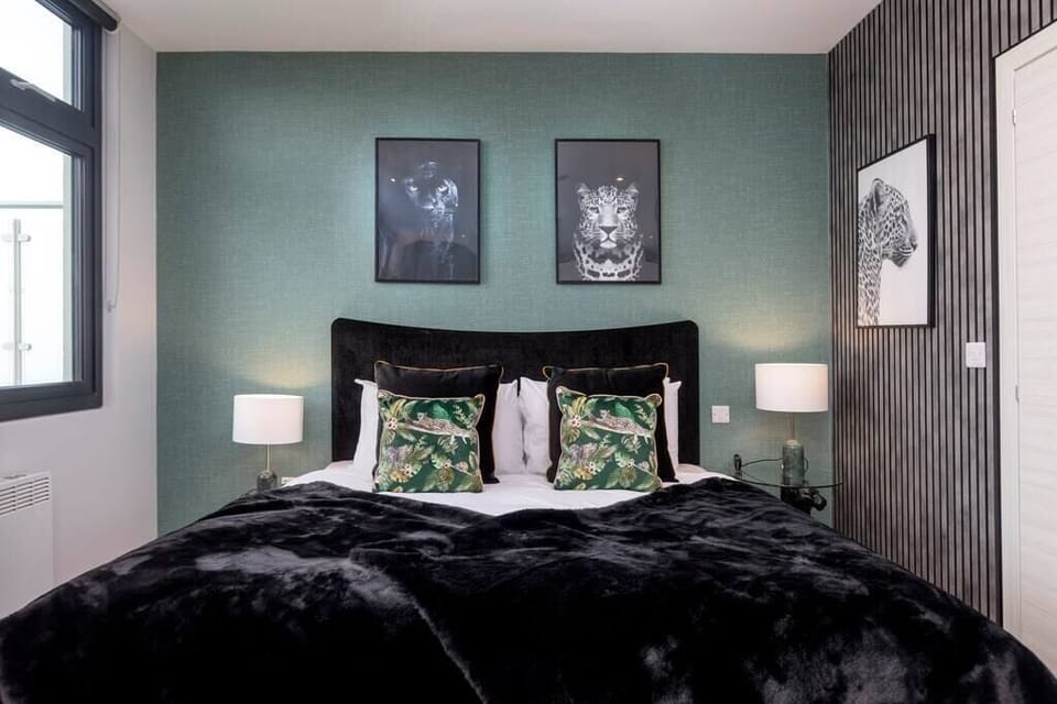 Integrated living, bedroom, and kitchen spaces in an open layout.