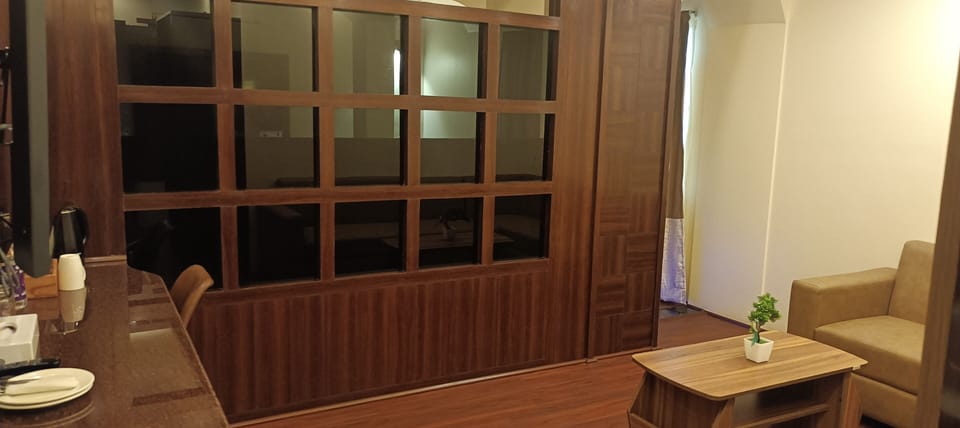 Signature Room | Living area | TV