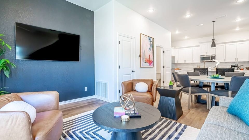 Kick back in a stylish, open-concept living space designed for comfort and connection. Whether you're debriefing after a Rangers game, watching pre-game coverage on the smart TV, or just relaxing with your crew—The Ryan's living area has you covered.