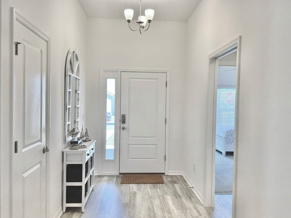 Foyer with Guest Sleeping Quarters #1 to the Right. This Area Can be Closed off w/ a Pocket Door for Added Privacy & Quiet