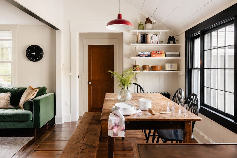 Set the table with the plates and bowls stacked and ready, and check the clock on the wall so you are not late for reservations. Pick a book off the shelf if you want something to read after the meal.