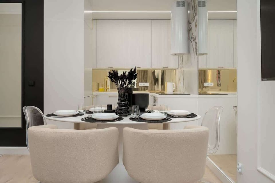 The sleek, fully equipped kitchenette with dining area.