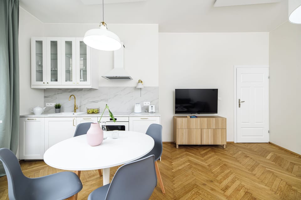 Deluxe Apartment | Living area | 42-inch TV with cable channels