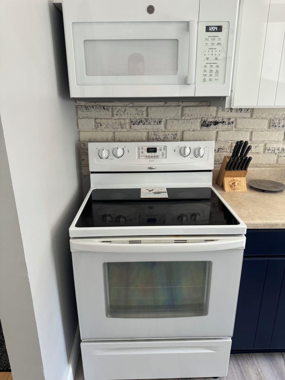 Electric stove and oven overhead microwave