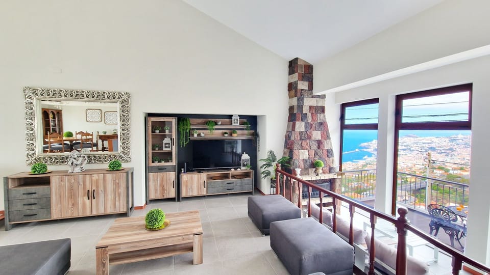 Casa Clementine by LovelyStay: Sunlit living room, sleek decor, modern TV, and stunning ocean views. Luxury and comfort combined. #spacious #oceanview