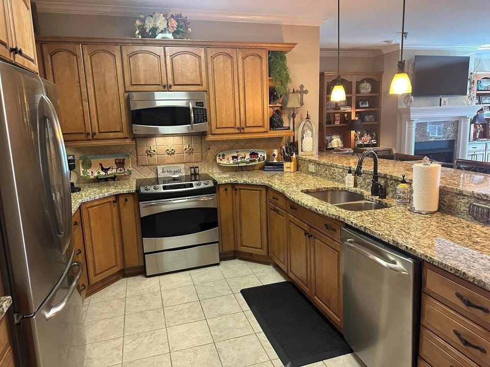 Kitchen, bar open to living room