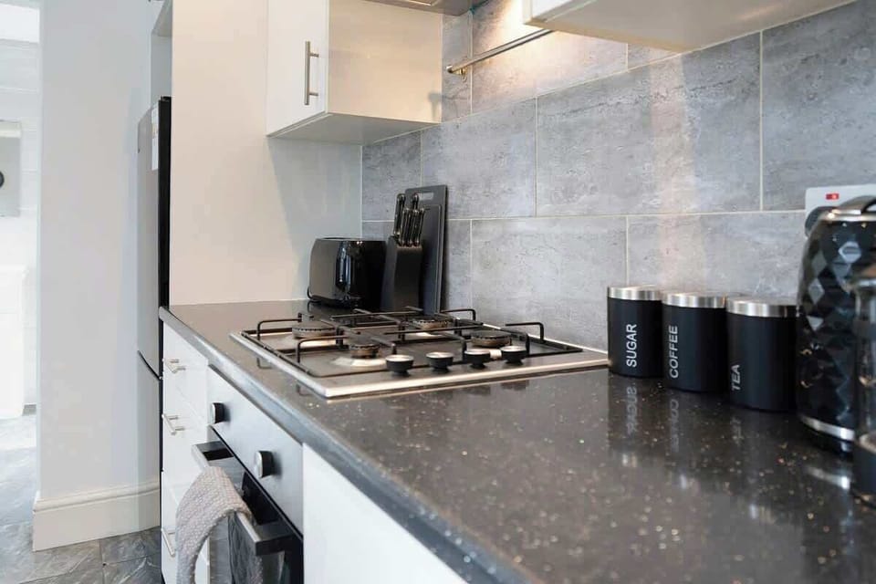 Family-friendly kitchen oasis equipped with all essentials, including a washer & dryer, oven, fridge and full cookware set. Plus, a 3-seater breakfast bar that ensures everyone feels right at home in this cosy culinary haven.