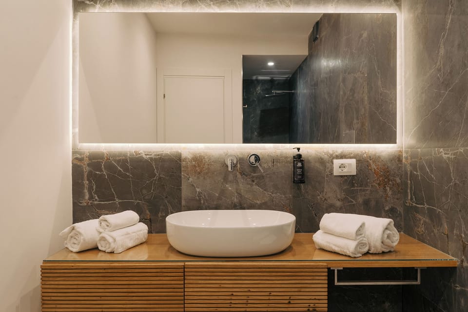 Superior Loft, Courtyard View | Bathroom | Shower, hair dryer, bidet, towels