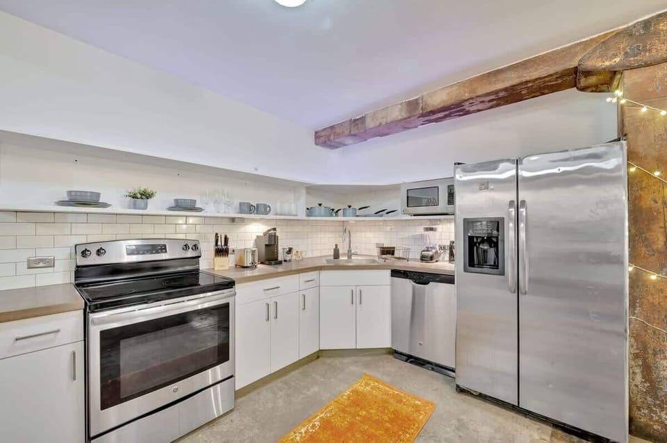 Fully stocked kitchen with beautiful stainless steel appliances
