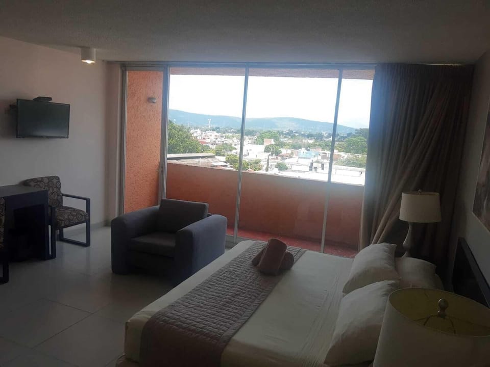 Deluxe Double Room, Balcony, City View | Desk, WiFi (free), bed sheets