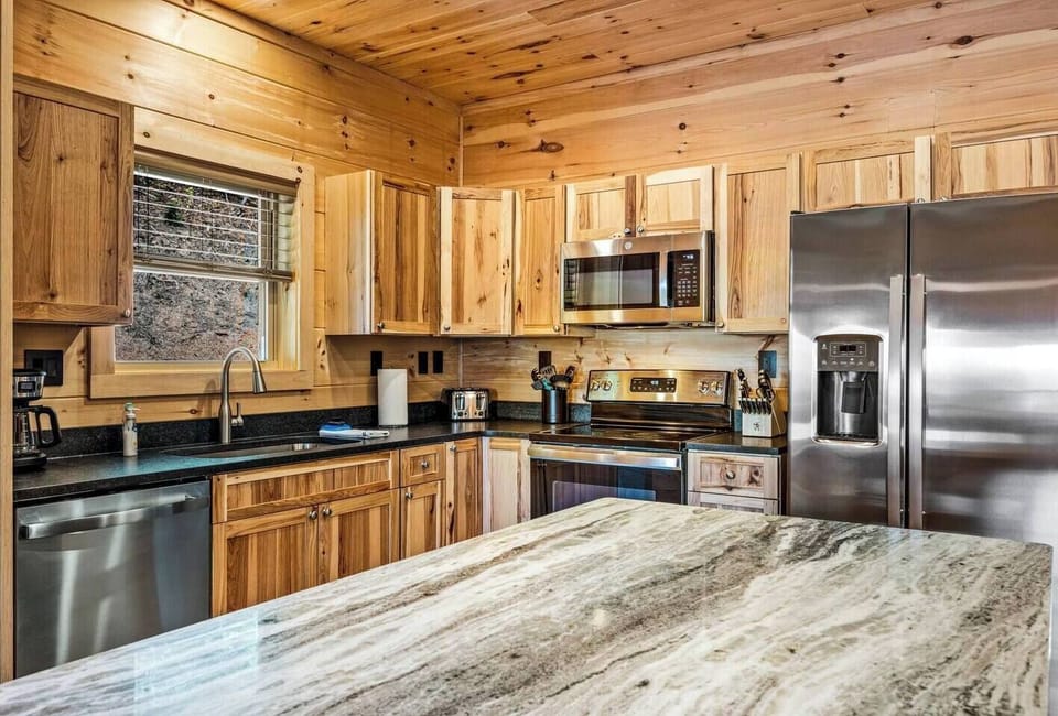 Kitchen is well stocked for cooking in.
