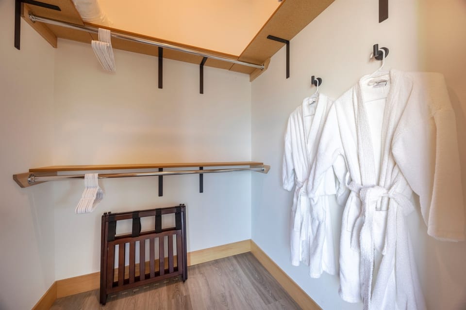 Walk in closet in primary bedroom.