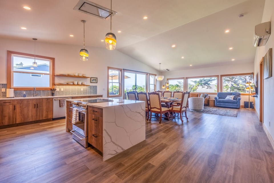 A kitchen that is both visually stunning and easy to use, from the induction range to the floating shelves.  Microwave, toaster, blender, cooking utensils and even a zester!