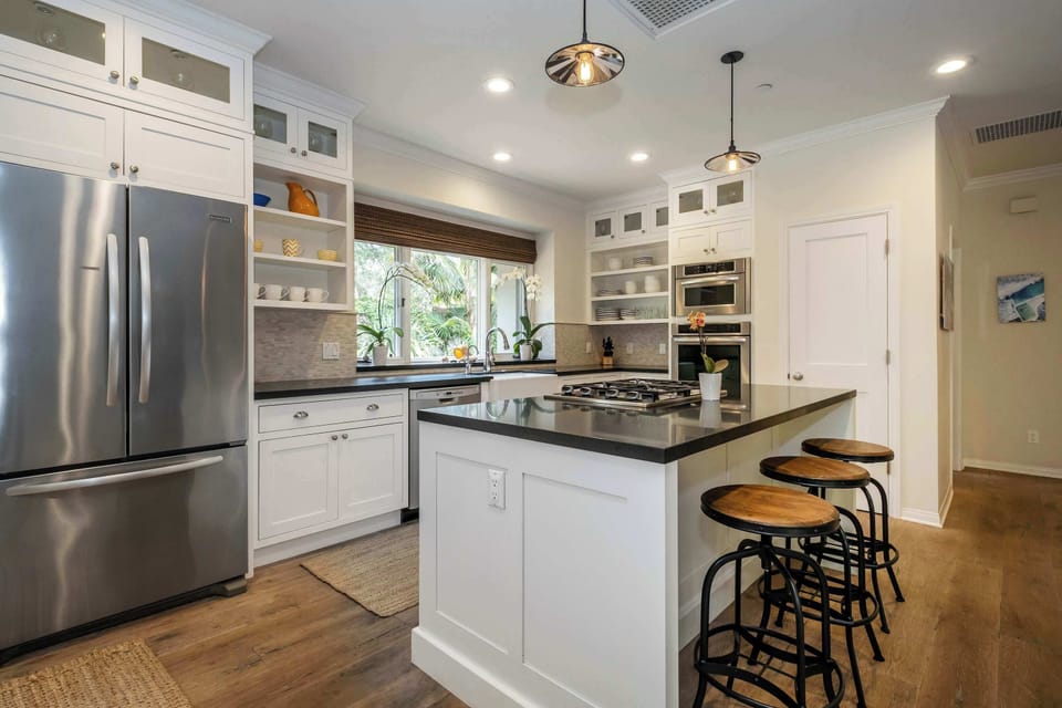 Full kitchen with drip coffee maker, blender, and more