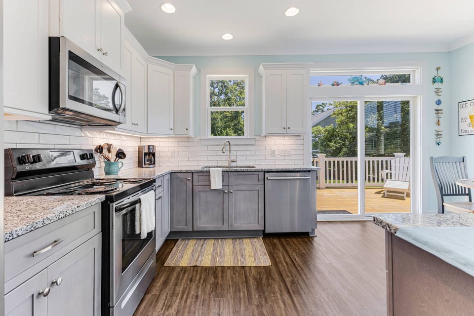 Another view of the kitchen area, with a door leading out to the porch.