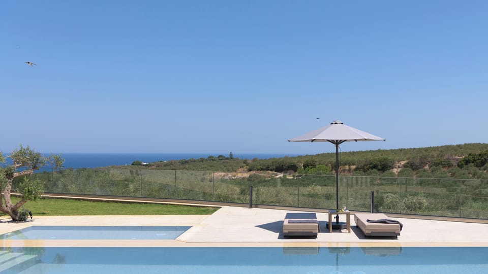 Marvel at the tranquil sea views from the poolside.