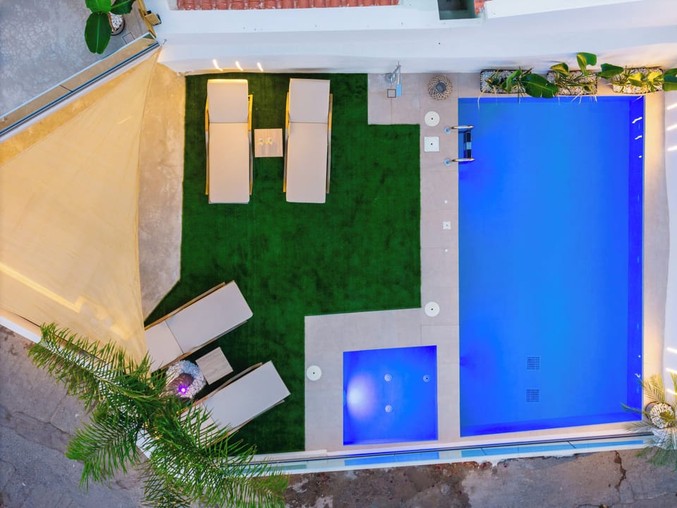 A bird’s-eye view that highlights the villa's architecture and serene setting.