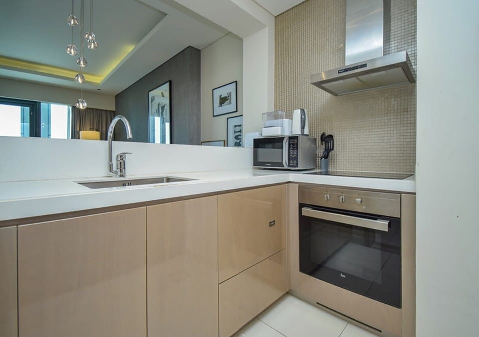 Luxury Apartment, 1 King Bed with Sofa bed, Pool View | Private kitchenette | Coffee/tea maker, electric kettle, dining table