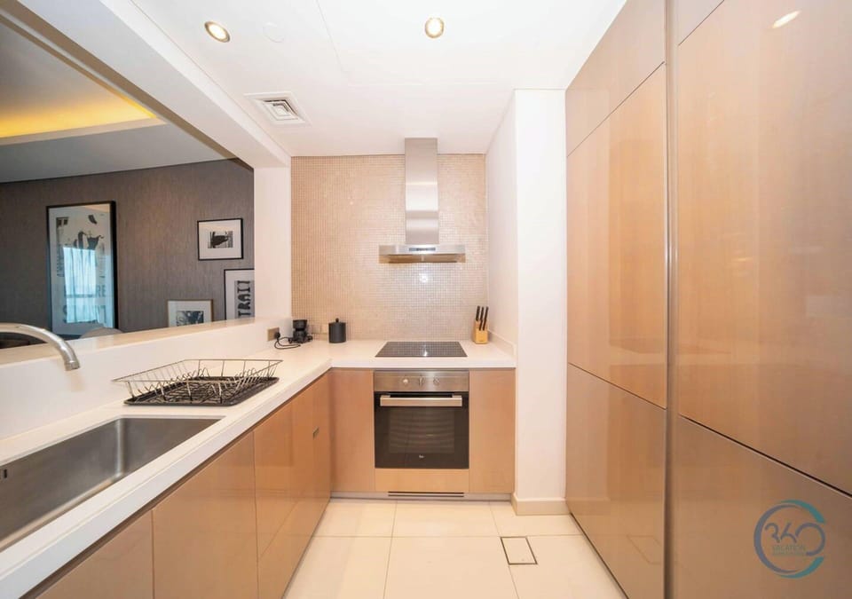 Luxury Apartment, 1 King Bed with Sofa bed, Pool View | Private kitchenette | Coffee/tea maker, electric kettle, dining table