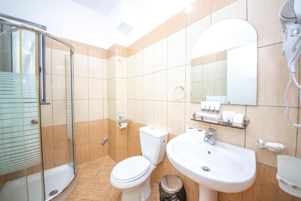 Deluxe Triple Room, Balcony, Partial Sea View | Bathroom | Shower, free toiletries, hair dryer, slippers