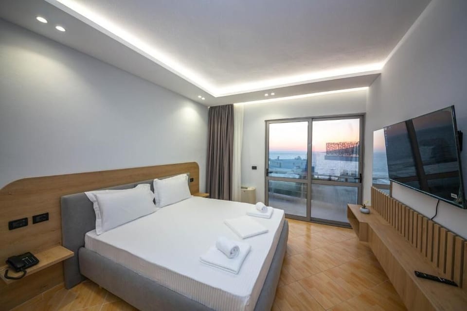 Deluxe Triple Room, Balcony, Sea View | In-room safe, desk, blackout drapes, WiFi (free)
