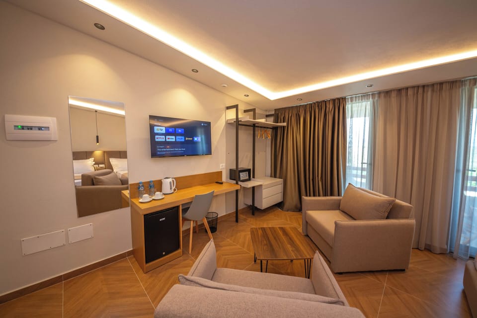 Triple Room, Balcony | Minibar, in-room safe, desk, blackout drapes