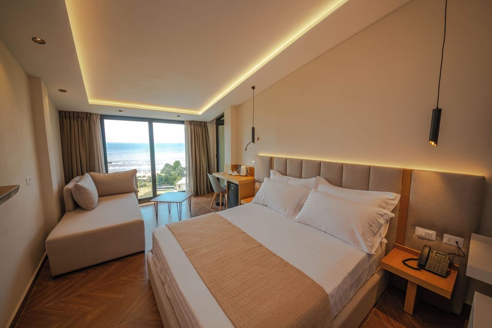 Superior Double Room, Balcony, Sea View | Minibar, in-room safe, desk, blackout drapes