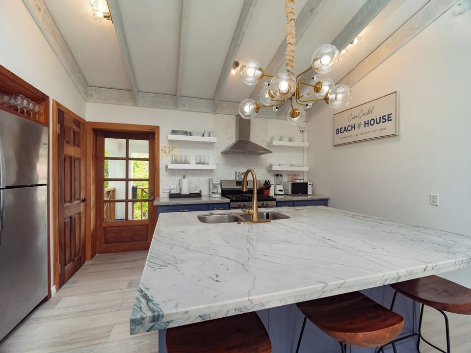 Open concept kitchen with island bar stool seating