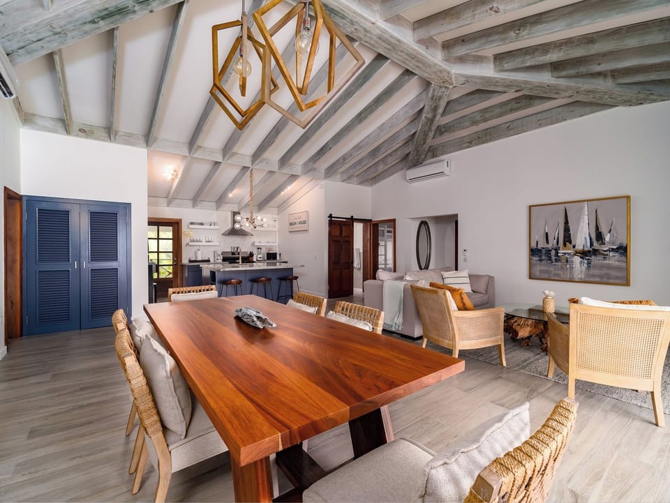 Dining area with room for 6 at table and 3 at kitchen island