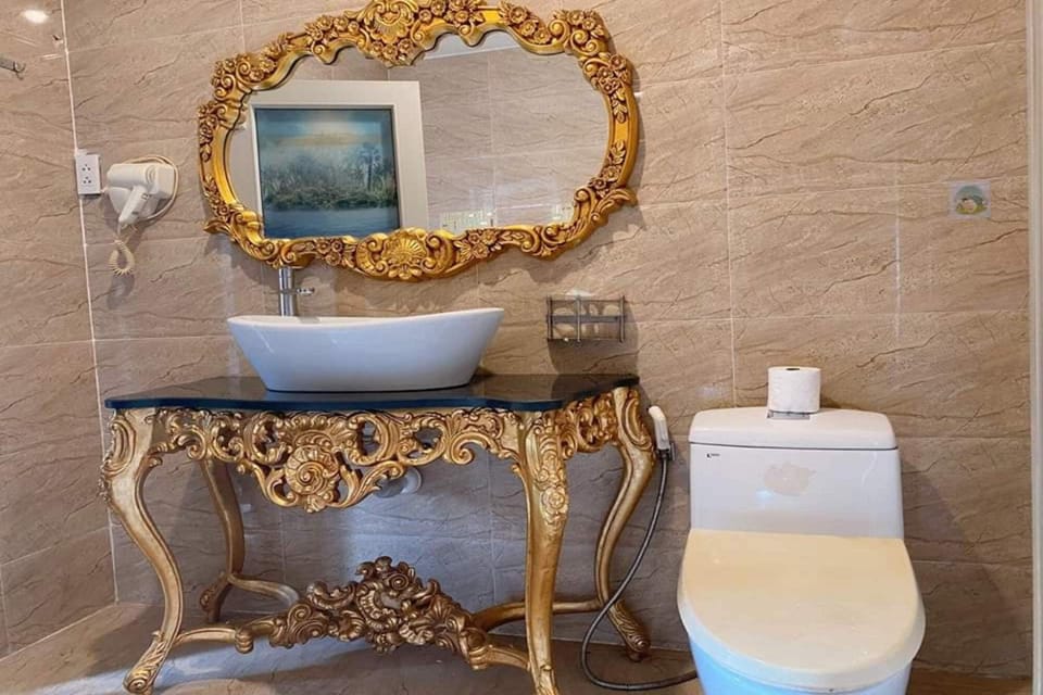 Deluxe Quadruple Room | Bathroom | Designer toiletries, hair dryer, slippers, bidet