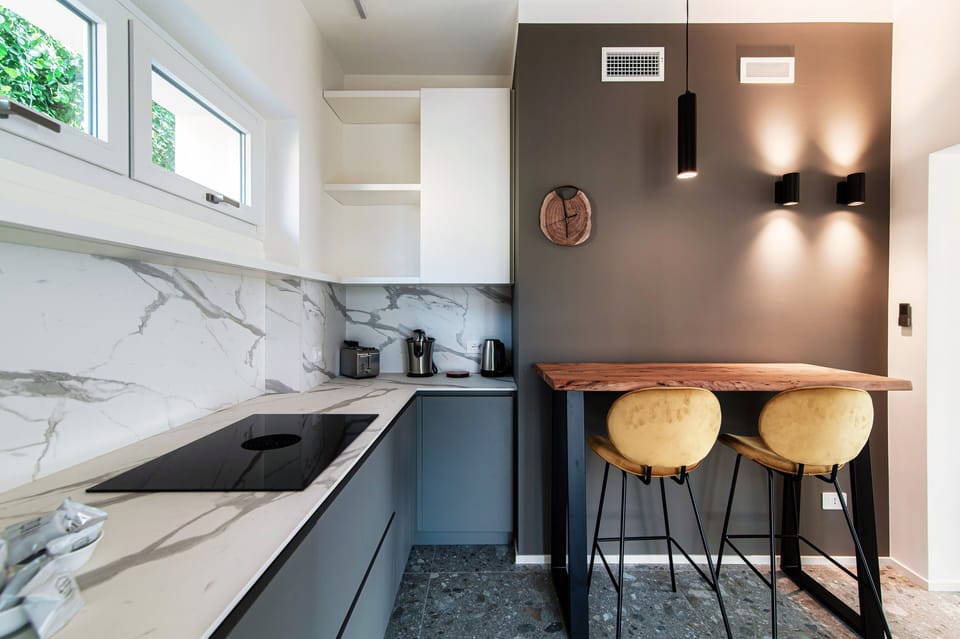 Apartment, Patio, City View | Private kitchen | Full-size fridge, oven, stovetop, dishwasher
