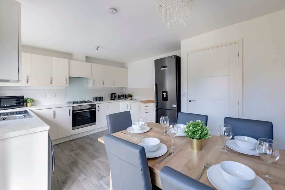 "Dine in elegance with our beautifully modern dining space—perfect for shared meals, conversations, and memorable moments."