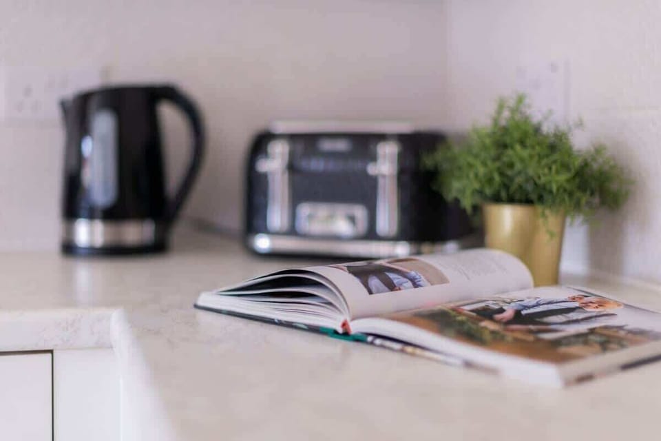 "Cook in style in our beautiful modern kitchen—fully equipped and thoughtfully designed for a sleek, effortless culinary experience."