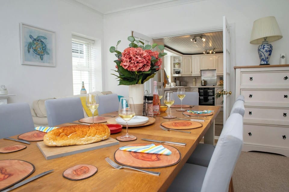 Dining room with double doors leading to kitchen