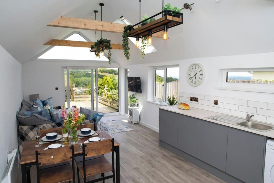 Open plan living area with patio doors leading to the deck