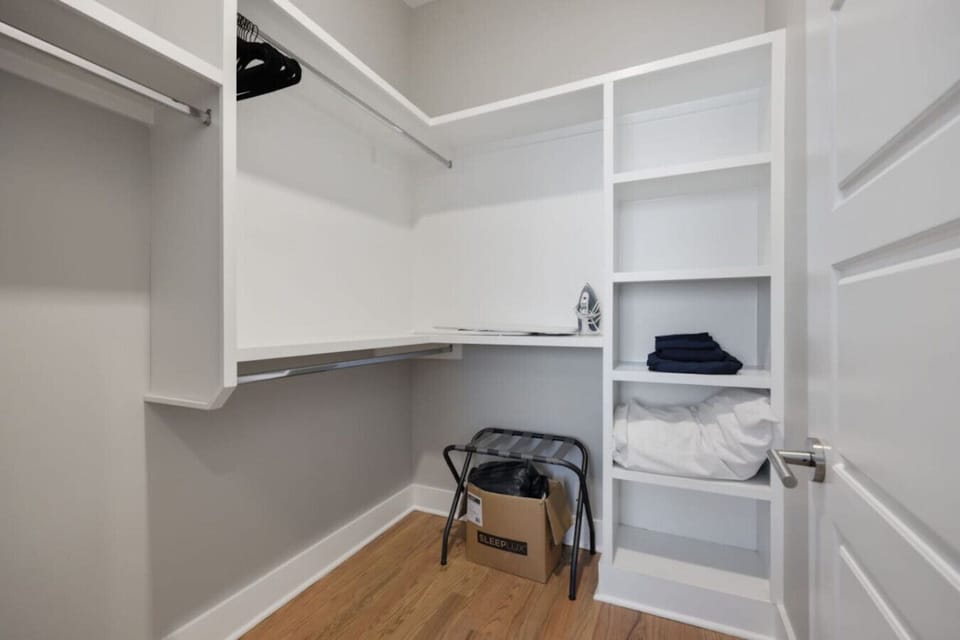 Yoga mat and exercise equipment on wall-mounted rack as guest amenity