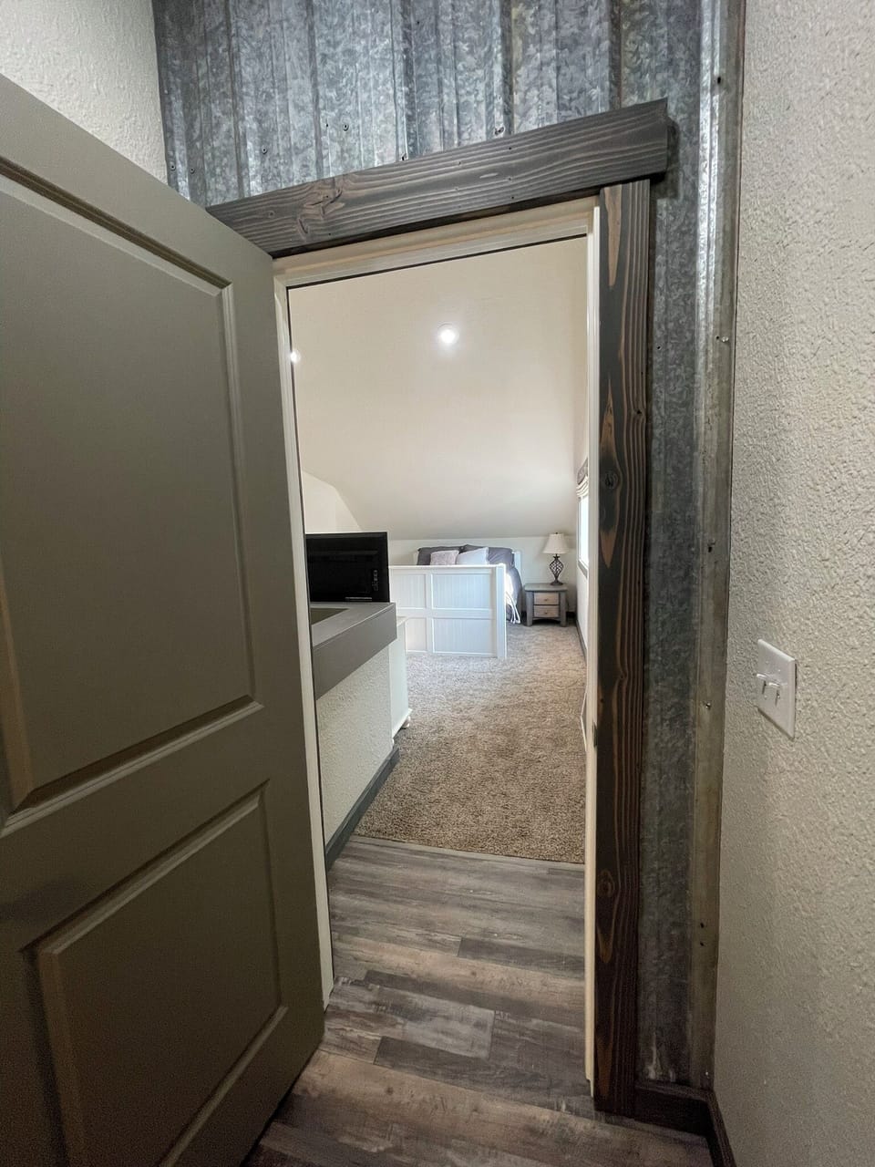 Door between upstairs bedroom and bathroom