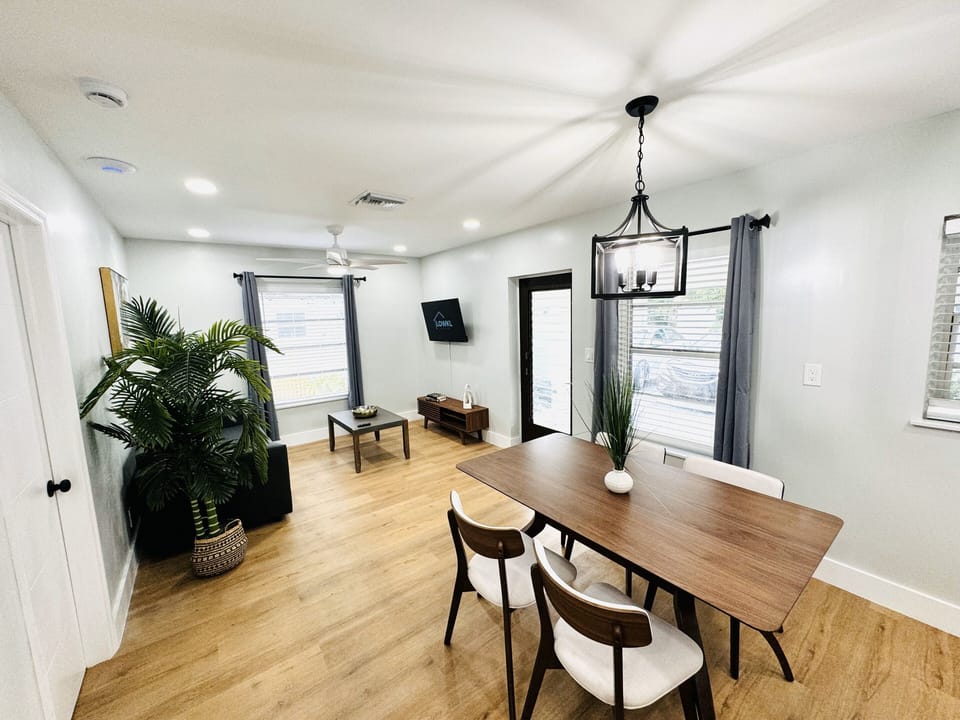 Welcome to your comfortable living room retreat, featuring a plush couch. The inviting ambiance is complemented by a practical coffee table, offering a convenient surface for your essentials. A smart TV provides endless entertainment possibilities.