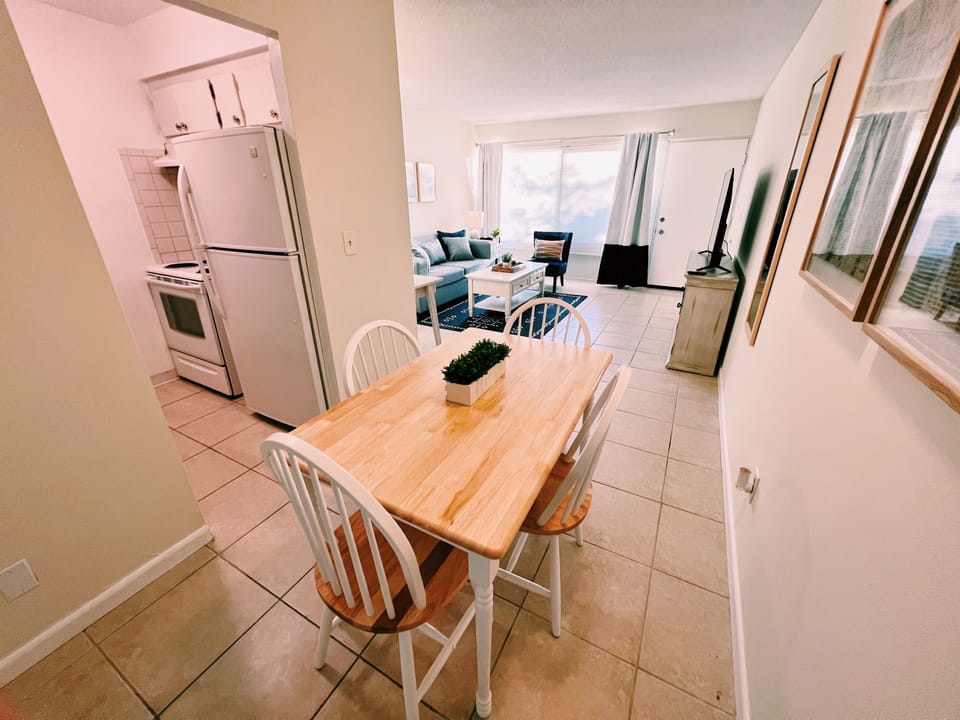Living Room

Sun-drench living area equipped with a comfortable leatherette sofa bed, coastal vibes, a work desk, 50" smart TV, and a dining table for 4 people. Free Wi-Fi is included to work and watch your favorite streaming services. 