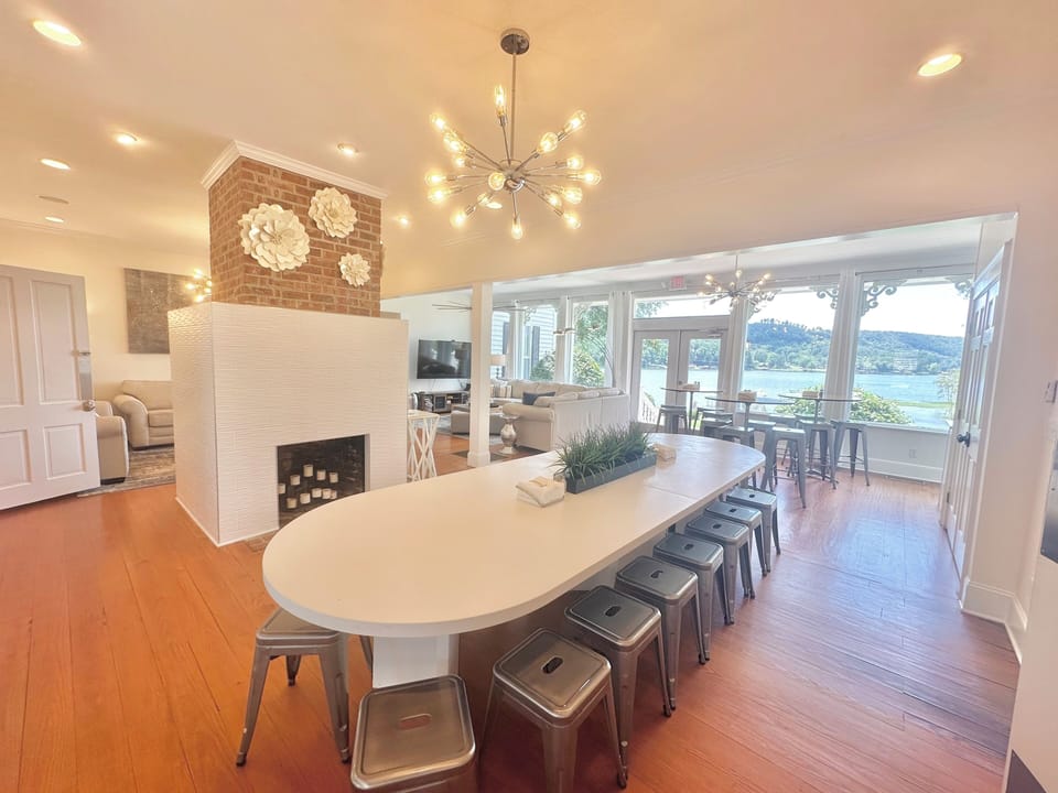 Dining for 28 in the main house + tons of seating on the back & side patio. 