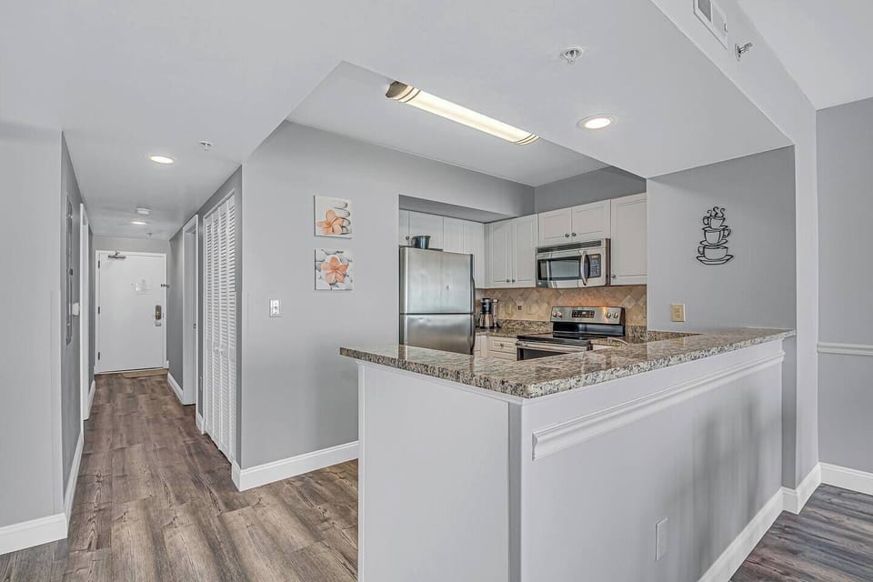 You'll find pleasure in preparing meals in this well-equipped kitchen.