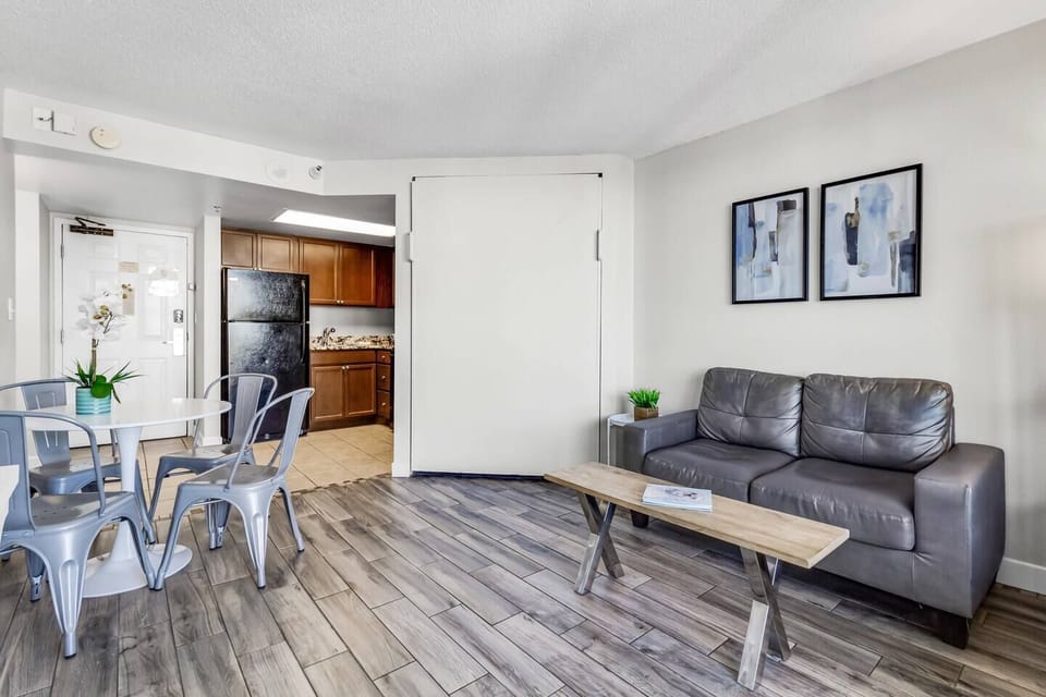 Embrace casual coastal charm in the living area, with comfortable sofas, beach-inspired decor, and a laid-back atmosphere perfect for relaxation.