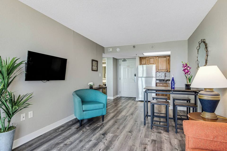 Make our suite's living area your entertainment centerpiece, with a high-quality TV taking center stage amidst chic decor and comfortable seating.