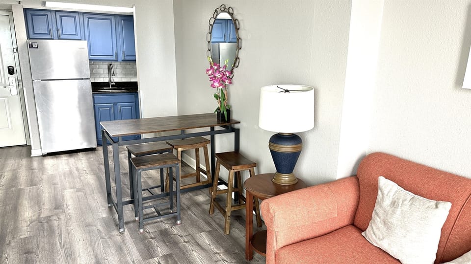 Experience the elegance of an open-concept kitchen in our suite, where stylish design seamlessly merges with functionality to create a sophisticated cooking space.