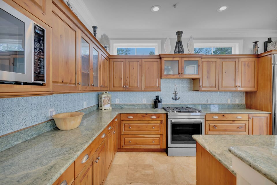 To your left from the entrance, a fully-equipped kitchen awaits, simplifying meal preparation.