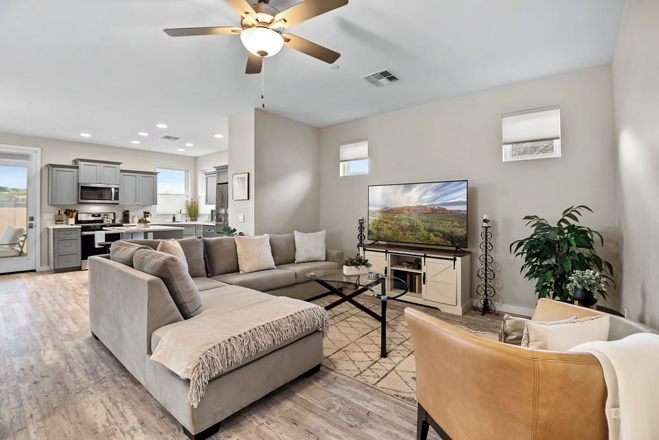Living Room offers a cozy sectional and a Smart TV