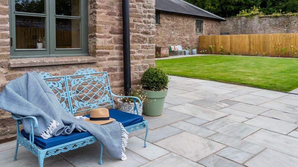 Read a book on the outdoor seating for a relaxing afternoon